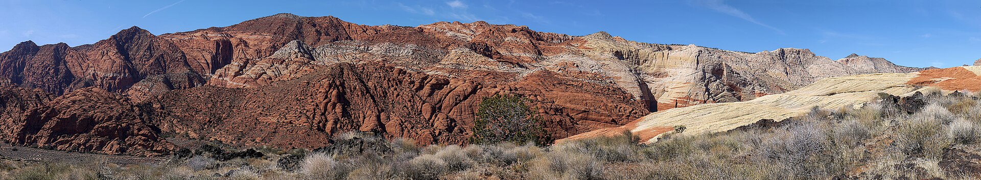 Black basalt lava rock and sandstone cliffs near Ivins, Utah